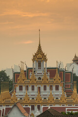 Naklejka premium Wat Ratchanatdaram and Loha Prasat Metal Castle at sunset, landmark and famous place of Bangkok city, Thailand
