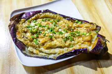 Roasted eggplant. Barbecue food. Chinese delicacy.