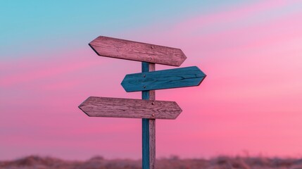 Wooden signpost against surreal pink sky with three directional arrows
