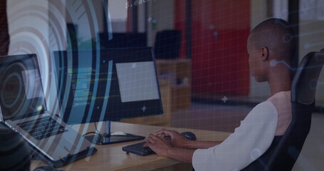 Image of data processing and scope scanning over biracial businesswoman using computer