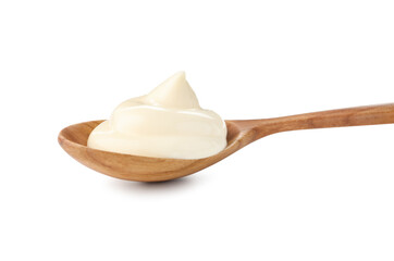 Tasty mayonnaise sauce in wooden spoon isolated on white