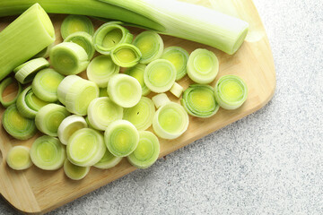 Fresh cut leeks on grey table, top view