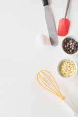 Ingredients and tools for baking delicacies displayed on a clean kitchen countertop