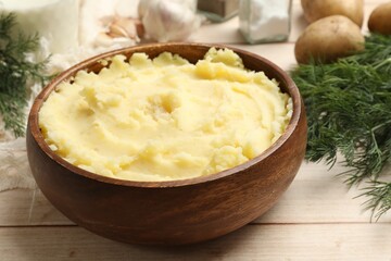 Delicious mashed potato on white wooden table, closeup