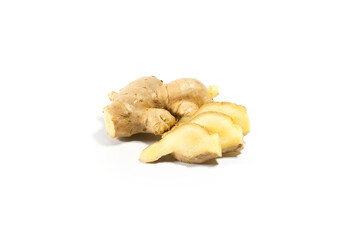 Fresh ginger with slices on white background.