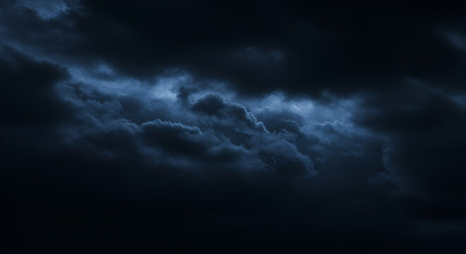 Black blue evening night sky with clouds. Dark dramatic sky background. Before the storm, thunderstorm, rain. Frightening, ominous, moody, creepy atmosphere