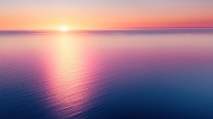 Fototapeta premium A serene ocean view at sunrise showcases vibrant hues of pink and orange reflecting on calm waters, ideal for wellness, relaxation, or nature-themed projects that evoke peace and tranquility,