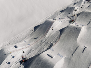 Aerial drone view of snowpark in dolomites, alps. Madonna di Campiglio winter ursus snowpark in Val...