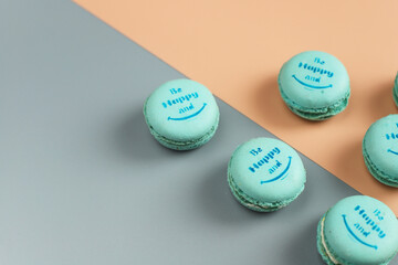 Colorful french dessert macarons with fresh fruits and nuts.