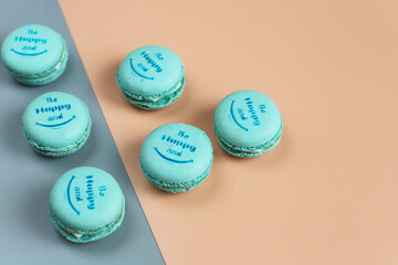 Colorful french dessert macarons with fresh fruits and nuts.