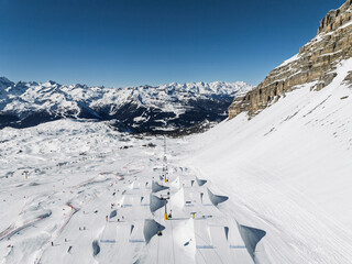 Aerial drone view of snowpark in dolomites, alps. Madonna di Campiglio winter ursus snowpark in Val...