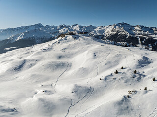 Aerial drone view of sunny winter in dolomites, alps. Spinale and Madonna di Campiglio drone view. Dolomites Brenta, Adamello park and Presanella moutain, Doss del Sabion skiarea trentino Italy.