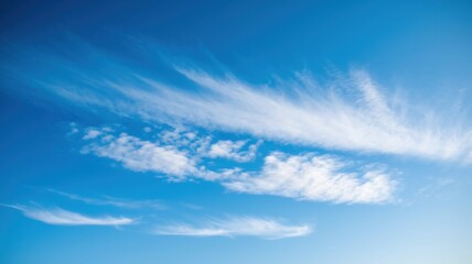 Serene Blue Sky with Wispy Clouds