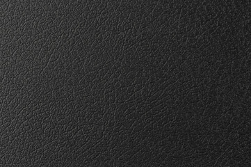 Textured black surface with intricate patterns showing depth and dimension details