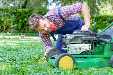 Man portrait mowing the lawn with lawnmower