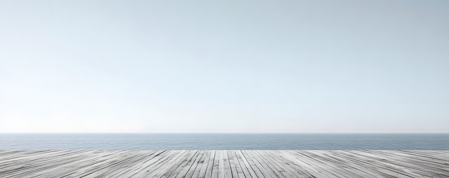 Minimalistic view showcases a wooden pier stretching towards the sea
