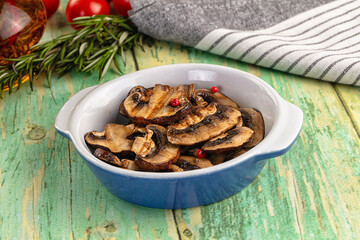 Tasty hot grilled champignon mushrooms
