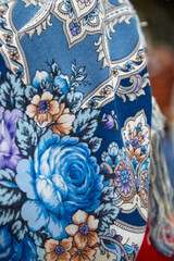 Russian folk pattern on a scarf and flowers