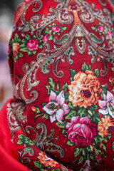 Russian folk pattern on a scarf and flowers