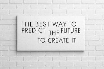 Fototapeta premium Quotes inspiration concept, best way to predict future is to create it with inspiring words