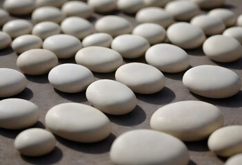 Fototapeta premium Minimalistic background/backdrop. White round stones / pebbles.