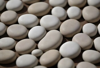 Minimalistic background/backdrop. White round stones / pebbles.