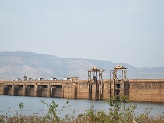 Dhom Dam in Maharashtra, India: A key earthfill and gravity dam on the Krishna River, built for irrigation & hydropower (4MW). A scenic tourist spot offering boating on Dhom Lake, known for Bollywood.