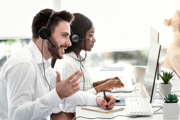 Team of customer service representatives assisting clients, resolving technical issues or selling...