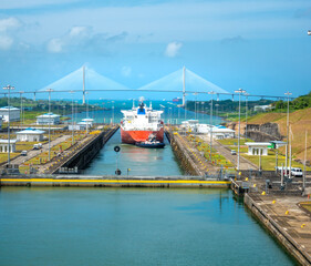 Conatiner ship descending to sea level at the news locks of the Panama Canal at Agua Clara on the...