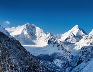 Obraz premium A snowy mountain landscape with a clear blue sky