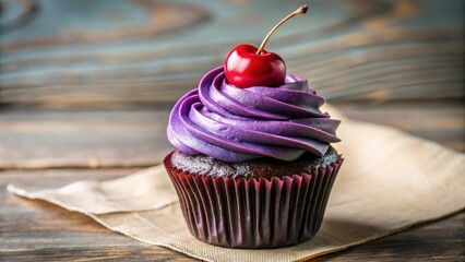 A single chocolate cupcake adorned with swirls of rich purple frosting, topped with a bright red cherry, resting on a rustic wooden table.