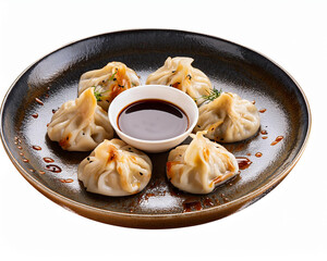 Delectable dumplings with splatters of soy sauce, chopped out