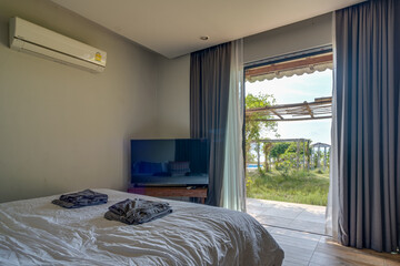 Cozy rustic bedroom with comfortable bed, wooden furniture and a relaxing atmosphere