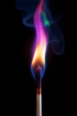 A matchstick ignites with vibrant, multicolored flames and swirling smoke, creating a mesmerizing display of fiery hues.