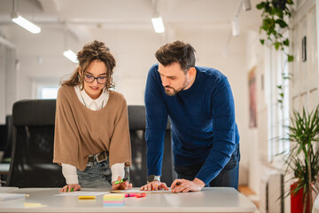 male and female colleagues work together prepare for business meeting