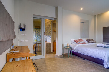 Cozy rustic bedroom with comfortable bed, wooden furniture and a relaxing atmosphere