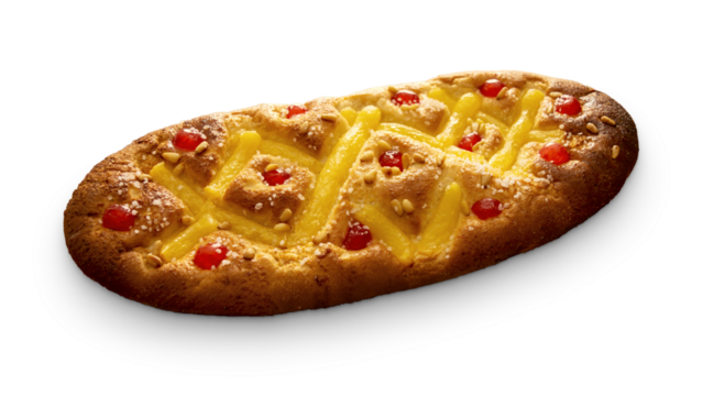 "Coca de Sant Joan" with cream, candied cherries and pine nuts, a festive Catalan sweet typical of the Saint John's Eve celebration, isolated on a blank background