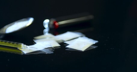 Drug paraphernalia on a black counter