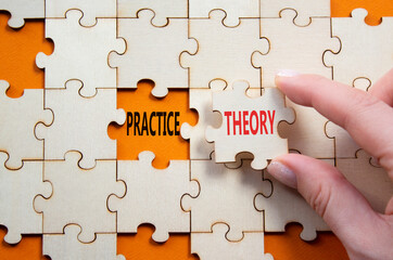 Theory or Practice symbol. Concept word Theory or Practice on wooden puzzle. Businessman hand....