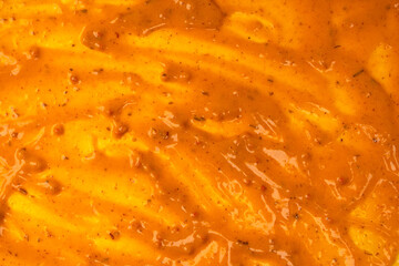 Yellow sauce splashes as a background.