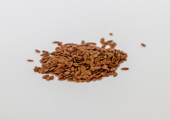 Close up shot of flax seeds on white background. Food