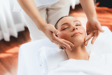 Caucasian woman enjoying relaxing anti-stress head massage and pampering facial beauty skin...