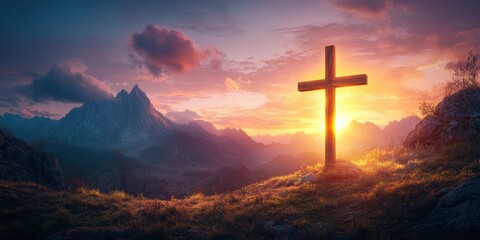 Sunrise over mountains with wooden cross silhouetted against colorful sky