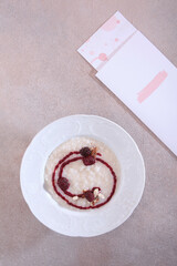 Homemade rice porridge for breakfast. Porridge with blackberries. View from above. Healthy food. Top view.