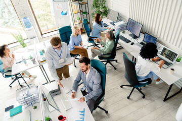Professional team working together in a modern office space focused on collaborative projects