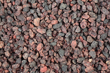 Heap of Himalayan rock salt as background, volcanic salt. Traditional seasoning in the culinary arts of India, Nepal, Bhutan, Bangladesh.