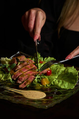 red meat steak with vegetables on a glass plate