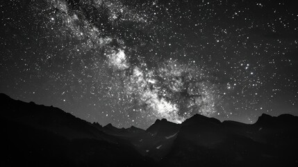 Stunning milky way over mountain range in night sky. International Dark Sky Week