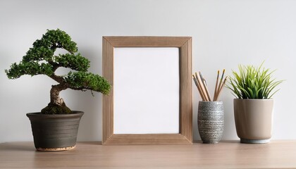 Minimalist Desk Scene Featuring a Blank Frame, Bonsai Tree, and Plants on White Background A Serene and ZenInspired Composition