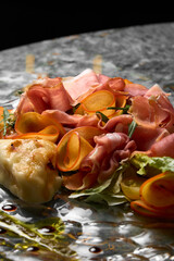 vegetable salad with prosciutto,pear and cheese